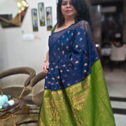 Handloom cotton saree in deep blue with green pallu and gold zari border
