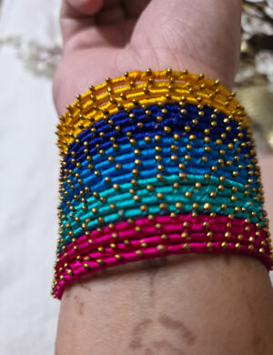 20251028_225659 Four colorful silk-wrapped metal bangles