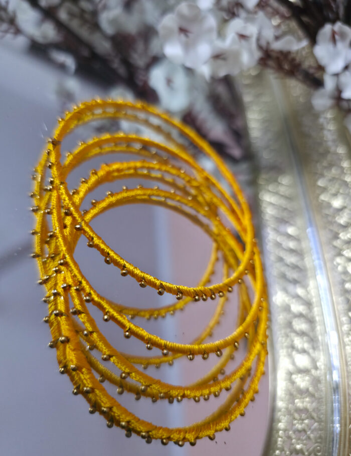 20251028_225904 yellow silk thread metal bangle set — ideal for festivals