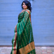 Haarini Green Banarasi Silk Saree with Copper Border