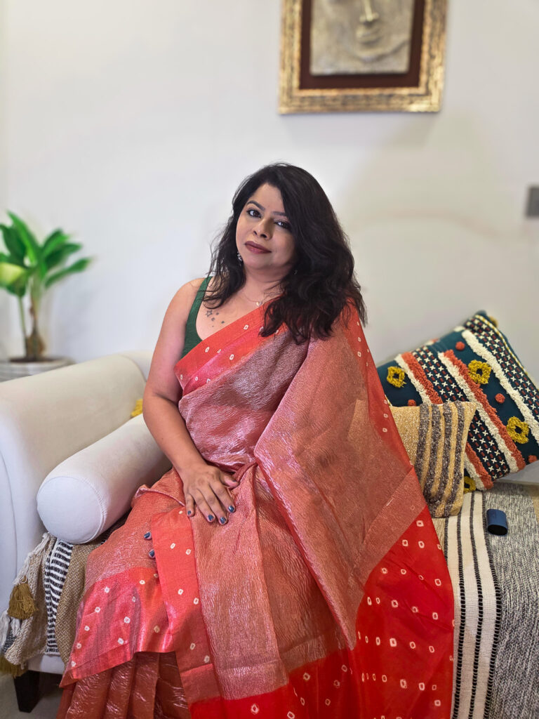 Gulnaar Crushed Tissue Orange Bandhej Border Saree